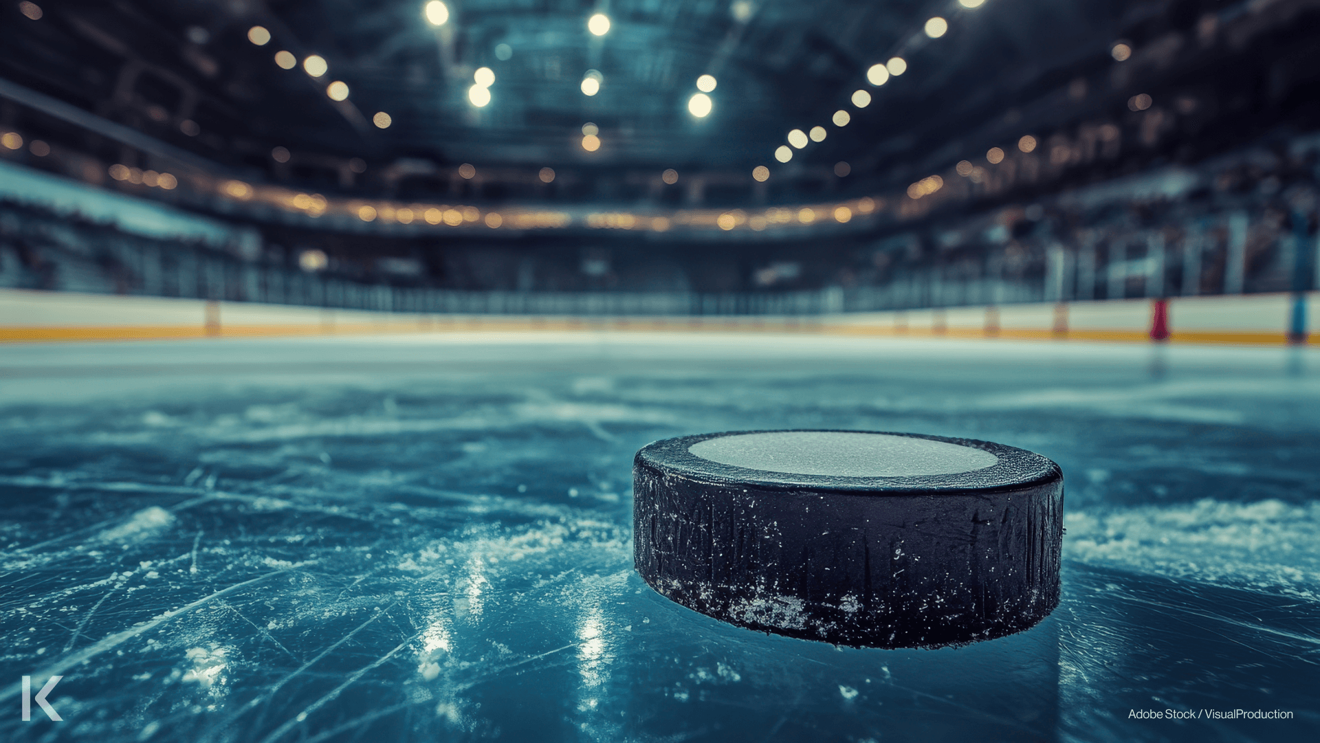 Hockey puck on scratched frozen ice rink